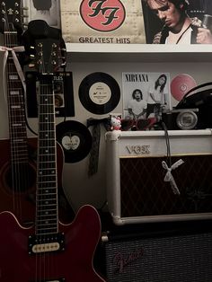 guitars and amps are lined up on the wall