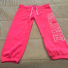 Pink Capri Sweat Pants “Love”. Never Worn Pink Cotton Cropped Leg Pants, Pink Cropped Cotton Pants, Casual Pink Knee-length Bottoms, Casual Pink Cropped Leg Pants, Casual Pink Cropped Bottoms, Casual Pink Capri Pants, Casual Pink Capri Length Pants, Pink Jumpsuit, Sweat Pants