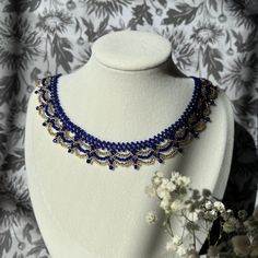 "Cobalt and gold necklace - inspired by the color palette and bright contrast in Vincent Van Gogh's Starry Night. Meticulously hand-beaded in New Jersey, U.S.A. Created with premium Miyuki Glass beads - these Japanese beads are known for their durability and uniformity.   This art deco style necklace gives the illusion of lace, and would make a perfect 3rd wedding anniversary present (glass), or the \"something blue\" in your wedding. Adjustable length: 14-16 inches. Designed to sit just above the collarbone. Gold-toned spring closure." Gold Necklaces With Bead Caps For Party, Gold Party Necklaces With Bead Caps, Elegant Royal Blue Beaded Jewelry, Handmade Royal Blue Round Beads Jewelry, Artisan Blue Jewelry With Gold Beads, Traditional Blue Jewelry With Bead Caps, Elegant Royal Blue Beaded Necklaces With Round Beads, Elegant Royal Blue Beaded Necklace With Round Beads, Elegant Royal Blue Round Bead Necklaces