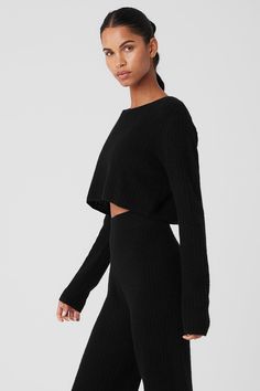 Movie marathons, grocery runs, road trips up the coast… It’s all cozier in this 100 percent cashmere waffle-knit top. Fitwise, it has long (scrunchable) sleeves, a wide neck, an easy fit and a cropped length that hits at the natural waist. Pair it with the matching pants or your go-to trousers, skirts, and shorts. Black Waffle Knit Pants, Cheap Stretch Sporty Sweater, Alo Yoga Long Sleeve Tops For Fall, Long Sleeve Alo Yoga Tops For Fall, Black Ribbed Cashmere Top, Alo Yoga Long Sleeve Winter Top, Alo Yoga Long Sleeve Top For Winter, Alo Yoga Long Sleeve Fall Sweater, Alo Yoga Fall Loungewear Tops