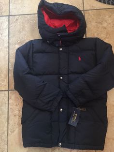 RALPH LAUREN BOYS PUFFER HOODIE JACKET SKI SNOW. COLOR NAVY AND RED. SIZE 7.  NEW WITH TAGS. RETAIL $119 SMOKE FREE AND PET FREE SERIOUS BIDDERS ONLY PLEASE!!!! PLEASE ASK ANY & ALL QUESTIONS BEFORE PLACING BID(S). PLEASE ASK IF IT IS NOT IN THE LISTING DESCRIPTION & IT IS IMPORTANT TO YOU. SALES ARE FINAL!!! SO ASK ANY & ALL QUESTIONS AHEAD OF TIME. I DO NOT ACCEPT RETURNS UNLESS ITEM HAS BEEN GROSSLY MISREPRESENTED. PAYMENT IS DUE 3 DAYS AFTER AUCTION HAS ENDED. NON PAYING BIDDERS WILL BE REPO Winter Sports Long Sleeve Hooded Jacket, Windproof Long Sleeve Puffer Jacket, Hooded Puffer Jacket With Fleece Lining, Windproof Long Sleeve Puffer Jacket For Cold Weather, Long Sleeve Hooded Jacket For Winter Sports, Hooded Windproof Sport Coat For Cold Weather, Fitted Winter Puffer Jacket With Fleece Lining, Fitted Long Sleeve Outerwear With Adjustable Hood, Winter Sports Hooded Jacket With Adjustable Hood