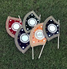 four decorative umbrellas sitting on the grass