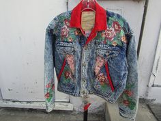 "80's/90's unique waist denim jacket, with red cotton trims, and painted floral patched areas all over, in size medium, and made by Bonjour. Jacket front has slot/flap pockets (4), metal button closure, and waist back button adjustments. In excellent condition, Shoulders 42\", Waist 34\", Chest 47\". PRICE IS $129.00SALE FINAL/AS IS/NO RETURNS." Vintage Red Denim Jacket For Fall, Vintage Red Cotton Denim Jacket, Vintage Reworked Denim Jacket For Spring, Reworked Vintage Denim Jacket For Spring, Vintage Style Upcycled Outerwear For Spring, Vintage Upcycled Outerwear For Spring, Vintage Patchwork Denim Jacket, Short Denim Jacket, Altered Clothing