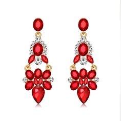 Bold earrings adorned with colorful crystal for a statement-making look. 0.94" W x 2.68" L 18k gold-plated copper / cubic zirconia / crystal Teardrop Chandelier, Earrings Teardrop, Bold Earrings, Red Crystals, Accessories Jewelry Earrings, Rhinestone Earrings, Fantastic Gifts, Chandelier Earrings, Earrings For Women