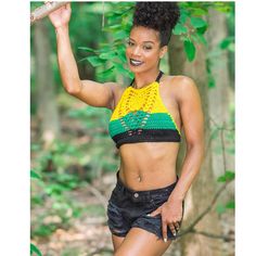 High neck jamaican crop top. 100% acrylic. Stretch Cropped Top For Beach, Stretch Cropped Crop Top For Beach, Stretch Crop Top For The Beach, Fitted Crop Top Halter For Music Festival, Summer High Neck Halter Top For Beach, Music Festival Fitted Halter Crop Top, Green Crop Top For Vacation, Trendy High Neck Halter Top For Summer, Stretch Cropped Top For Festival