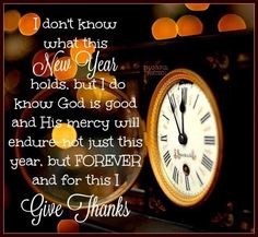 a clock with the words give thanks written in front of it and lights behind it