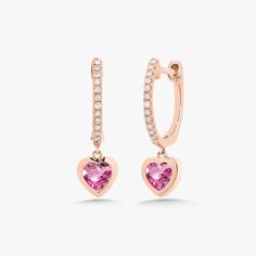 We guarantee you will fall in love with the Kait Heart Drop Huggies! This item is sold as a pair. If interested in buying as a single, please contact us. Metal: 14k White Gold / 14k Yellow Gold / 14k Rose Gold 2 Heart Shaped Gemstones: Approx. 0.42 - 0.65 ctw per pair depending on gemstone Pink Sapphire, Blue Sapphire, or Emerald (Diamond available upon request) 24 Round Brilliant Cut Diamonds: approx. 0.06 ctw H Color, SI1 Clarity Diamonds Diameter: Approx. 10mm Closure: Hinge Fine Jewelry Heart Pendant Earrings For Valentine's Day, Heart Pendant Earrings For Valentine's Day, Valentine's Day Fine Jewelry Heart Pendant Earrings, Valentine's Day Heart Pendant Fine Earrings, Elegant Huggie Jewelry For Valentine's Day, 14k Gold Heart Charm Earrings, 14k Gold Heart Earrings Fine Jewelry, White Gold Huggie Jewelry For Valentine's Day, 14k White Gold Diamond Earrings For Valentine's Day