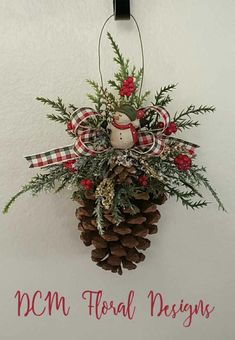 a pine cone hanging from the side of a wall