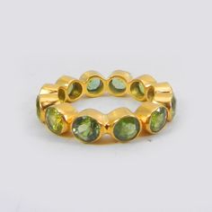 Minimalist Ring- Peridot Handmade Eternity Band Ring- Gemstone Ring- Stackable Ring- Gold Plated Brass Ring- Anniversary Gifts- Boho Ring Description : ~ Material : Brass & Gemstone ~ Gemstone : Peridot Hydro ~ Gemstone Shape : Round ~ Stone Size : 4 mm Approx ~ Ring Weight : 2.85 Gram Approx ~ Setting Type : Bezel ❣❣ Handmade Item ❣❣ **Made to Order** » G E M S T O N E S D E T A I L S « **Gemstone structure may vary from the image as two gemstones do not have the same structure** If you wan Gifts Boho, Green Stone Rings, Gold Rings Stackable, Eternity Band Ring, Gold Band Ring, Minimalist Ring, Boho Gifts, Boho Ring, Brass Ring