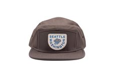 It's true... sometimes it rains in Seattle. Keep the rain out of your face with this retro inspired 5-panel Seattle hat! ✓ Choose one of two classic PNW colors ✓ Designed in Washington State ✓ The perfect Seattle hat Gray hats are Otto Cotton Twill Five Panel Camper with adjustable nylon strap and plastic. Blue hats are Richardson Cotton Twill 5 Panel with adjustable nylon strap and plastic. One size fits most. Adjustable Waterproof Short Brim Hat, Waterproof Adjustable Flat Brim Hats, Adjustable Waterproof Flat Brim Hat, Waterproof Flat Brim Hat With Adjustable Fit, Waterproof 5-panel Travel Hat, Waterproof Adjustable 5-panel Hat, Vintage 5-panel Hat For Outdoor Activities, Vintage 5-panel Outdoor Hat, Vintage 5-panel Travel Hat