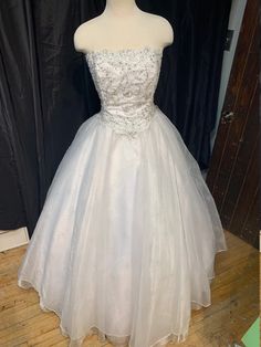 Handmade to order - process takes 2 to 4 weeks.  Can be made in any color combinations-the possibilities are endless!!  Custom, one-of-a-kind gowns are my specialty The skirt is made of 6 layers of fabric to make it full volume, including a satin underskirt, 3 layers of tulle, organza, and specialty embellished organza topskirt Lace Bodice is fully lined and boned, and features 100's of genuine Swarovski crystals.  Can be made with zipper back closure, or lace-up back ~PRICE WILL BE DETERMINED ON THE FABRIC AND TRIM CHOICES THAT ARE SELECTED The Price could be Higher or Lower depending on the Fabric & Trim Choices that are made.... When you order the dress you will provide us with a few measurements and the dress is custom made to fit you! each dress is one of a kind. All sales are final - Organza Pageant Dress For Debutante Ball During Prom Season, Fitted Gown With Lined Bodice For Quinceanera, Elegant Fitted Bodice Gown For Quinceanera, Elegant Gown With Fitted Bodice For Quinceanera, Quinceanera Fitted Bodice Ball Gown, Prom Season Organza Ball Gown Evening Dress, Quinceanera Gown With Boned Bodice In Tulle, Quinceanera Gown With Boned Bodice, Quinceanera Tulle Gown With Boned Bodice