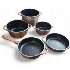 four pots and pans sitting on top of each other