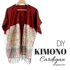 a red kimono hanging on a hanger with the words diy kimono cardigan