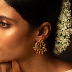 Description: Inspired by the beauty of nature, Bhagya Chandbali earrings are a symphony of Indian motifs- from flower to the Iconic Indian bird peacock. Studded with Kempu stone, this gold-plated silver earring is a testament to the skill of our master artisans. This timeless chandbali earrings are finished with an array of gold plated loop drops- perfect for a modern and ethnic look. Product Information : Materials used: 925 Silver with Antique Plating Stones: Semi-precious stones Length: 4cm F Elegant Navratri Festive Earrings, Elegant Danglers For Navratri, Elegant Festive Earrings For Navratri, Intricate Design Hoop Earrings For Wedding, Round Earrings For Rituals And Festivals, Elegant Earrings For Wedding And Navratri, Elegant Wedding Earrings For Navratri, Festival Earrings For Rituals, Navratri Drop Danglers