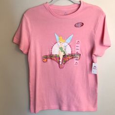 Disney Sweet & Sassy Tinkerbell Pink Tee Shirt; Size Medium. Brand New With Tags. 0021 Casual Pink Shirt For Disney Fan Events, Spring Disney T-shirt For Fan Events, Spring Disney Style Short Sleeve Tops, Sassy Tinkerbell, Pink Tee Shirt, Pink Tee, Disney Tops, Shirt Color, Tee Shirt