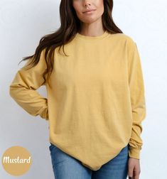 Blank Comfort Color Long Sleeve Shirt Long Sleeve Tee Wholesale Clothing Blank Shirt Long Sleeve Tshirt Women Long Sleeve Men Tee Long Shirt ✨ PRODUCT DESCRIPTION ✨ ∘ ∘ For an Oversized look, consider sizing up 1-2 above your normal size. ∘ ∘ UNISEX TSHIRT ∘ Relaxed fit ∘ Medium fabric ∘ 100% Preshrunk Cotton ∘ Garment-dyed fabric ∘ Double-needle topstitch seams for long-lasting ∘ ∘ Design colors may differ slightly from the final printed item due to the printing process and monitor calibration. ∘ ∘  📏 SIZE 📏 ∘ Adult Unisex sizing. We have a size chart on our listing photos ↑. ⏱️ SHIPPING & PRODUCTION TIME ⏱️ ∘ Please allow 1-5 business days for processing time. ∘ Shipping time is 3-5 business days. ✨ CARE INSTRUCTIONS ✨ ∘ Inside out, wash cold with a delicate cycle ∘ Hang Dry ∘ Do not u Oversized Yellow Long Sleeve Top, Soft-washed Tops With Shirttail Hem For Fall, Yellow Crew Neck Top For Fall, Yellow Relaxed Fit Solid Color Tops, Yellow Relaxed Fit Solid Tops, Yellow Long Sleeve Cotton Sweatshirt, Yellow Cotton Long Sleeve Sweatshirt, Oversized Soft-washed Long Sleeve Tops, Solid Color Cotton T-shirt For Fall