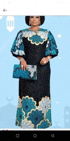 an african woman in a black and blue dress