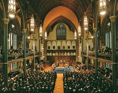 an overhead view of a large church with people sitting in pews and lights on the ceiling