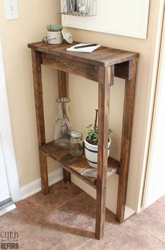 a wooden shelf with some plants on it and a potted plant next to it