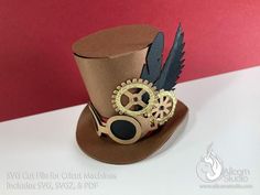 a top hat with gears, feathers and a feathered eyeglasses on it