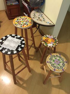 three stools with different designs on them