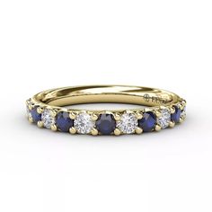 an 18k yellow gold sapphire and diamond wedding band with three diamonds on each side