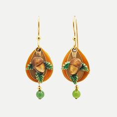 Nurture a little nature in your jewelry collection with this pair of metal drop earrings featuring an abundance of layers. A dimensional acorn sits on a trio of leaves and layered teardrop shapes in warm fall colors and a dangling green bead. These autumn earrings make a memorable gift or a fun self-purchase. | Silver Forest metal drop earrings feature layered leaves and acorn designs with dangling green bead accent. | Surgical steel ear hooks with 18k gold overlay. | Hypoallergenic; nickel-, le Autumn Earrings, Metal Drop, Fall Earrings, Gold Overlay, Warm Autumn, Ear Hook, Green Bead, Personalized Accessories, Memorable Gifts