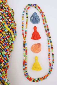 You can create your own boho style in a flash with these festive and bright "LOVE beads."Made in former Czechoslovakia for use in Africa, these beads have been in our possession for 20+ years, stored in a warehouse. The colors in these strands will go with just about anything and are super-fun for layering on as summer necklaces! No two strands are alike.Bead Size: Approx. 4x3mm, but that does vary as there are lots of different bead shapes on these strands.Strand Length: Approx. 36"Approximate Colorful Bohemian Spacer Beads, Bohemian Colorful Spacer Beads, Multicolor Wooden Beads For Festival, Colorful Beaded Bracelets For Beach Festivals, Artisan Multicolor Beaded Necklace For Beach, Colorful Beads Jewelry For Beach Festivals, Bohemian Colorful Beads For Gifts, Spiritual Beaded Necklaces With Oval Beads For Beach, Bohemian Colorful Beads As Gifts