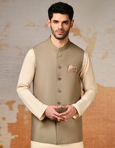 Elevate your traditional attire with this Beige blended waistcoat, a timeless piece that adds sophistication to your look. Crafted with meticulous attention to detail, it features a classic design that complements any kameez shalwar or kurta. Perfect for weddings, festive occasions, or cultural events, this waistcoat i Traditional Fitted Beige Nehru Jacket, Fitted Beige Nehru Jacket In Traditional Style, Traditional Fitted Outerwear For Work, Elegant Semi-formal Straight Kurta Set, Elegant Semi-formal Set With Straight Kurta, Festive Fitted Beige Nehru Jacket, Elegant Festive Straight Kurta Nehru Jacket, Traditional Festive Outerwear For Work, Elegant Fitted Straight Kurta Outerwear