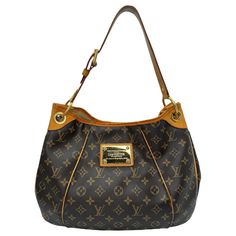 This stylish shoulder bag is finely crafted of classic Louis Vuitton monogram on toile canvas. It features an adjustable vachetta leather shoulder strap, vachetta leather piping and trim complete with polished brass hardware including a large engraved front plate. The top opens to a light beige microfiber interior with pockets. Brand: Louis Vuitton Material: Monogram coated canvas; Cowhide trim Date/Authenticity Code: SD3131 Production Year: 33th week of 2011 in the U.S.A. Measurements: 14" x 11 Formal Bags With Gold-tone Hardware And Monogram Canvas, Formal Monogram Canvas Bag With Gold-tone Hardware, Monogram Canvas Satchel Shoulder Bag With Gold-tone Hardware, Elegant Brown Monogram Canvas Shoulder Bag, Elegant Monogram Canvas Shoulder Bag For Business, Luxury Formal Shoulder Bag In Signature Coated Canvas, Luxury Formal Shoulder Bag In Coated Canvas, Tote Shoulder Bag With Gold-tone Hardware And Monogram Canvas, Designer Monogram Canvas Shoulder Bag With Leather Handles