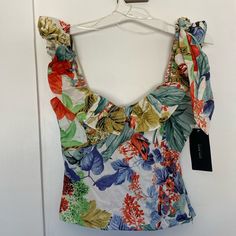 Tropical Floral Print Top With Zipper On The Side. Size Xs From The Zara Basic Collection. Brand New With Tags Still On. Gorgeous To Wear With A Skirt Or Jeans! Trendy Ruffled Tops For Beach Season, Multicolor Tops For Brunch During Beach Season, Fitted Tropical Tops For Spring, Tropical Spring Tops, Multicolor Sleeveless Tops For Brunch, Yellow Tropical Tops For Spring, Yellow Tropical Top For Spring, Summer Yellow Tops With Tropical Print, Yellow Tropical Print Tops For Summer