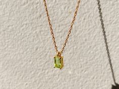 A dainty stone and delicate metallic chain are combined to create this Gold Pendant Necklace in bright peridot, your new favorite wear-anywhere accessory. The birthstone for the month of August is Peridot. This bright green gemstone brings energy to the wearer and symbolizes creativity. Authentic natural peridot stone; Made of 14K gold-filled. Pendant size: 6mm x 4mm with 18" chain. Hypoallergenic, nickel, and lead-free; Tarnish resistant. Ideas to choose your Birthstone Necklace: Your birth mon Everyday Fine Jewelry Green Necklaces, Everyday Fine Jewelry Green Necklace, Green Fine Jewelry Necklace For Everyday, May Birthstone Pendant Necklace With Delicate Chain, Delicate Green Birthstone Necklace For Gift, Delicate Green Birthstone Necklace, Green Peridot Necklace For May Birthstone, Minimalist Peridot Birthstone Jewelry, Dainty Green Gemstone Birthstone Necklace