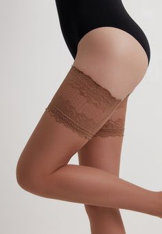 20 denier Flame fashion stockings by Conte Elegant is outstanding stockings with the most beautiful lace top, which, like a border, separates elastic yarn and delicate skin. They call more to the open part of the thigh than simply hide the body. They create a contrast of fabric and skin in appearance and feeling.Flame stockings by Conte Elegant are made of multi-filament Lycra yarn, which provides high elasticity, durability and softness. These stockings are well kept on the legs due to the wide Thigh High Lace Hosiery With Lace Trim, Stretch Lace Stockings With Lace Trim, Elegant Stretch Stockings With Lace Trim, Elegant Stretch Lace Trim Hosiery, Elegant Stretch Lace Legwear, Elegant Stretch Legwear With Lace Trim, Elegant Lace Stretch Legwear, Sheer Lace Thigh High Stockings, Sheer Lace Thigh-high Stockings