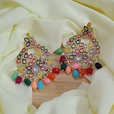 Multicolored Earrings, Bollywood oversized Kundan Earring Indian| Pakistani Jewelry Indian wedding| Bridesmaid gifts| Punjabi Haldi function Bollywood Look Indo Western Earring Big statement Jhumka earrings featuring a stunning yellow and pink colour combo! The gold Kundan accents make these earrings look absolutely Royal and beautiful. They are sure to impress anyone paired with an ethnic outfit! Color, shades, and texture displayed may slightly vary from the actual product due to digital image limitations. We request you to consider these minor variations. Please expect the possibility of some slight imperfections when buying handmade jewelry. Please let me know if you have any questions. Thank you so much for visiting my shop. Indian Wedding Bridesmaids, Western Earring, Multicolored Earrings, Wedding Bridesmaid Gifts, Jewelry Indian Wedding, Earring Indian, Haldi Function, Earrings Outfit, Polki Earrings