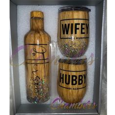 two wooden wine bottles in a box with glitters on them and the words wife, hubby