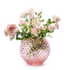 a vase filled with lots of pink flowers