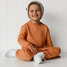 Stay cozy in style this season with the Pumpkin Dream Pullover! This one-of-a-kind, long-sleeved top is crafted from bamboo for an ultra-comfie fit and the perfect seasonal pumpkin hue! Whether you're cozying up by the fireplace or pumpkin picking, this pullover is *your* perfect pick! Made from the softest and most breathable seasonal bamboo viscose material, your babe won't want to take this off! Designed for all the love and extra snuggles! Sleep and play with zero irritation with our tag-les Pumpkin Dream, Ring Bearer Suit, Pageant Shoes, Girls Dress Outfits, By The Fireplace, Pajama Romper, Pumpkin Picking, Christmas Blankets, The Fireplace