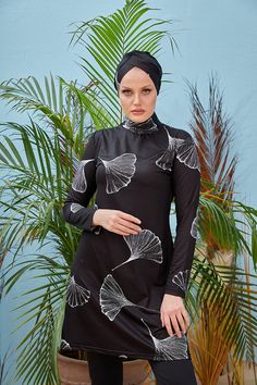 Spend the summer vacation both comfortably and stylishly with this nice specially designed product. This black full-coverage swimsuit with nice white details will make you a favorite of the beaches! Parachute Design, Coverage Swimsuit, Muslim Swimwear, Full Coverage Swimsuit, Swimsuit Collection, Tulip Print, White Details, Blue Leaves, Muslim Women