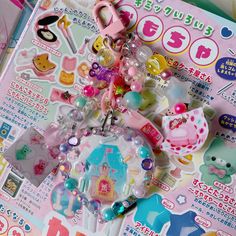 an assortment of toys and stickers on top of a magazine