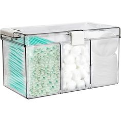 a clear container filled with lots of white balls