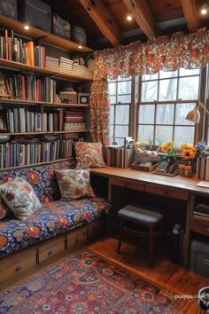 a room with a couch, bookshelf and window