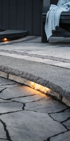 the light is shining on the stone walkway