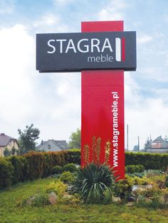 the sign for stagra mobile in front of some bushes