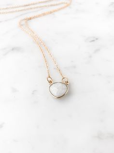 This listing is for one beautiful Dainty Rainbow Moonstone Heart Necklace. D E T A I L S * This necklace has a genuine Rainbow Moonstone pendant * This necklace is 16 inches long * Made with 14k gold filled chain   HAPPINESS GUARANTEE: We want you to LOVE your new jewelry! M O R E ∙ G O O D ∙ T H I N G S Instagram: instagram.com/halfheartcreations (@halfheartcreations) Facebook: facebook.com/halfheartcreations Etsy Store: etsy.com/shop/halfheartcreations A B O U T ∙ H A L F H E A R T C R E A T I O N S Everything is handmade by me. My goal is to create trendy and unique jewelry from the heart. Don't worry - you're in good hands. Everyday Gemstone Heart Pendant Necklace, White Dainty Gemstone Necklace, White Moonstone Necklace With Delicate Chain, Dainty White Gemstone Necklace, Minimalist White Gemstone Necklace, White Heart Pendant Necklaces For Everyday, White Moonstone Necklace With Adjustable Chain, White Crystal Necklace With Delicate Chain As Gift, White Crystal Necklace With Delicate Chain For Gifts