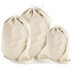 three canvas bags with ties on each side