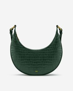 Croc-Embossed Vegan Leather 100% Recycled Plastic Lining 12" W × 2" D × 11.2" H (30.5cm x 5cm x 28.5 cm) 15.9″-17.9″ (40.5cm - 45.5cm) Handle Drop Detachable Strap (Adjustable) Gold Hardware Zip Closure 1 Interior Pocket 1 Zipping Pocket 1 Slip Pocket Imported Green Leather Satchel With Crocodile Pattern, Green Leather Bag With Crocodile Pattern, Green Crocodile Pattern Satchel For Daily Use, Green Crocodile Pattern Shoulder Bag, Green Leather Shoulder Bag With Adjustable Handle, Green Crocodile Pattern Shoulder Bag For Everyday Use, Green Crocodile Pattern Shoulder Satchel, Green Crocodile Pattern Tote Bag, Green Crocodile Pattern Crossbody Bag