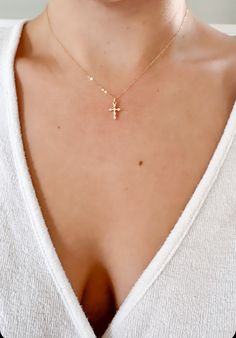 "Little Cross Necklace, tiny cross necklace, Dainty Minimalist Cross, 18K Gold Filled Chain, Gold Layering Necklace, cross necklace ♥This necklace features a delicate 14k gold filled chain, with a hint of shimmer.  Adorned with a gold & cz cross pendant.  Finished with a traditional gold filled spring clasp.   ♥The Cross is a dainty 12mm x 8mm  ♥LENGTH - The length shown is 16\". Please choose your desired chain length when checking out. ♥FINISH - Available in gold & silver. Please choose your d Women Cross Necklace, Dainty Cross Necklace, Tiny Cross Necklace, Silver Cross Necklace, Tiny Cross, Mini Cross, Small Crosses, Gold Necklace Layered, Minimalist Necklace