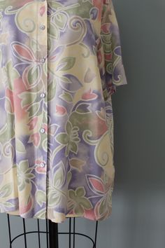 "Vintage summer short sleeve tunic blouse in soft rayon material. Featuring a pastel muted floral and swirl leaf print. Winged collar. Tag: ALFRED DUNNER Fits like medium, large (vintage Size 12): 17\" shoulders Bust up to 44\" Length 28\" Sleeves 10\" Condition: excellent!" Daywear Printed Short Sleeve Blouse, Vintage Flowy Floral Print Blouse, Flowy Floral Print Vintage Blouse, Flowy Vintage Blouse With Floral Print, Multicolor Short Sleeve Blouse For Daywear, Multicolor Rayon Blouse With Short Sleeves, Flowy Short Sleeve Blouse With Floral Print, Printed Rayon Short Sleeve Blouse, Mid Century Books