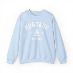 Vintage Montauk New York sweatshirt with coastal sailing graphic design. Ideal for any situation, a unisex heavy blend crewneck sweatshirt is pure comfort. These garments are made from polyester and cotton. This combination helps designs come out looking fresh and beautiful. The collar is ribbed knit, so it retains its shape even after washing. There are no itchy side seams on these sweaters. .: 50% cotton, 50% polyester.: Medium-heavy fabric (8.0 oz/yd² (271.25 g/m²)).: Loose fit.: Sewn-in labe Nantucket Sweatshirt, Montauk New York, Hamptons New York, New York Sweatshirt, Boring Clothes, Joy Of Life, Sweatshirt Vintage, L And Light, Fleece Sweater