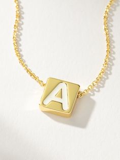 If there’s always an initial necklace in your stack, you need our Bold Letter Necklace. This block letter necklace brings a pop to your stack with its white lettering detail. Layer with our Textured Stud Necklace for a simple, everyday look. For a fully personalized look, shop our Initial Jewelry. | Gold Bold Letter Block Pendant Necklace with Initial A | Women's Jewelry by Uncommon James Trendy Initial Necklace With Letter Beads As Gift, Trendy Initial Necklace With Letter Beads For Gifts, Trendy White Letter Jewelry, Trendy White Letter Shaped Jewelry, Trendy Personalized Initial Necklace For Everyday, Trendy Everyday Initials Name Necklace, Everyday Trendy Initials Name Necklace, White Monogram Jewelry For Everyday, Minimalist White Charm Necklace For Personalized Gift